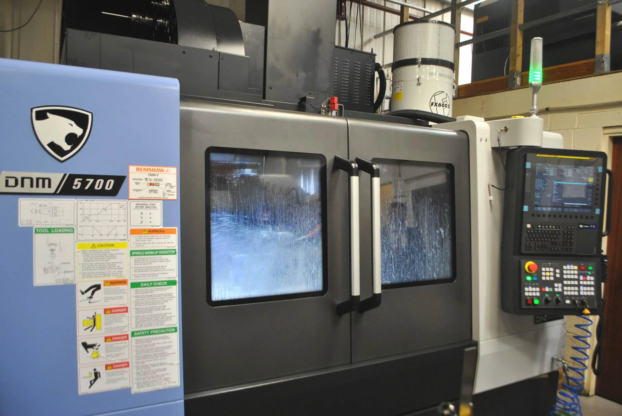 Exterior of closed DNM vertical machining centre